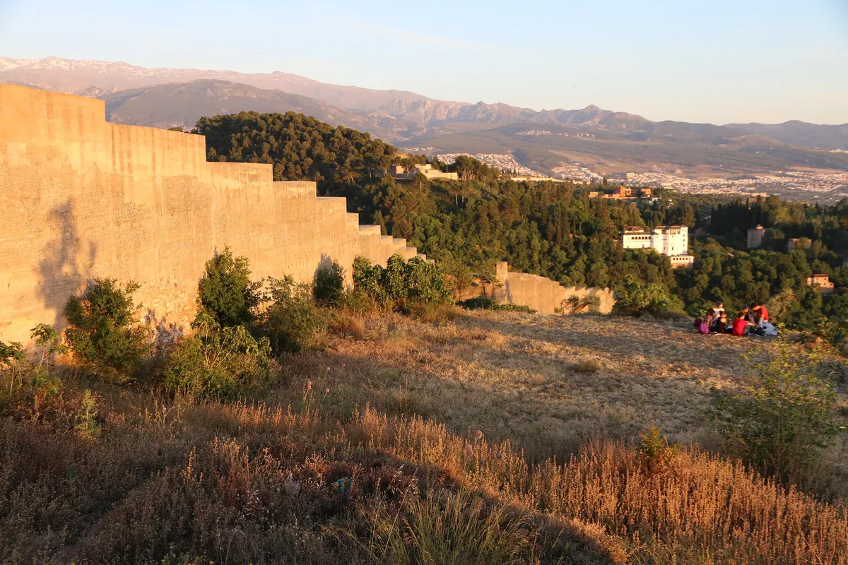 Evening light on a Moorish wall at the top of the Sacromonte hill, with the Sierra Nevada in the distance